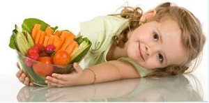 Girl with bowl of veggies